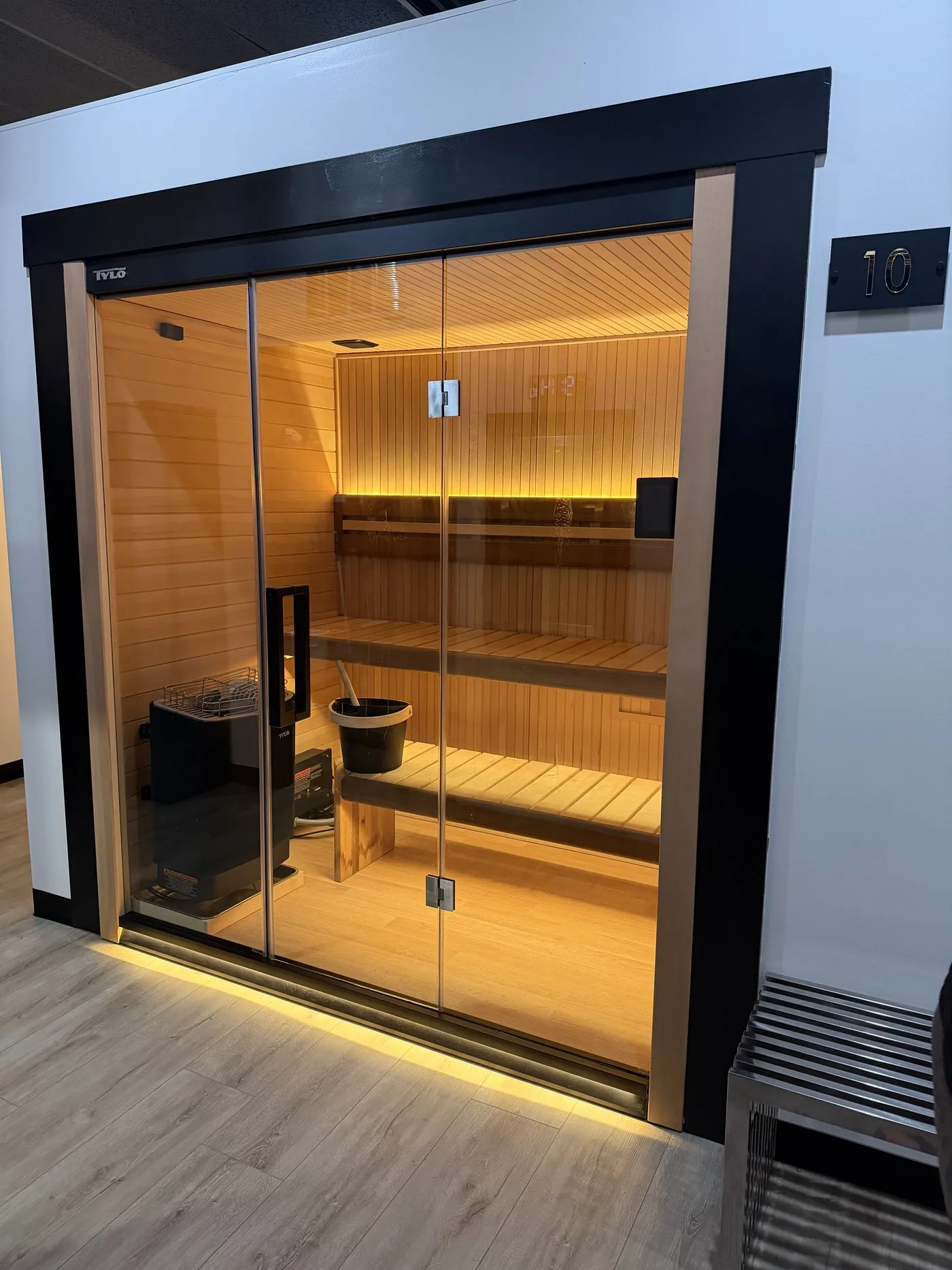 Tylö sauna with cedar interior and glass front